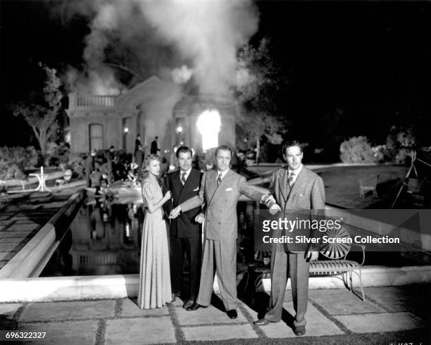 From left to right, actors Virginia Grey, Tom Neal, William Powell and Patric Knowles in the swimming pool fire scene from the sequel 'Another Thin...