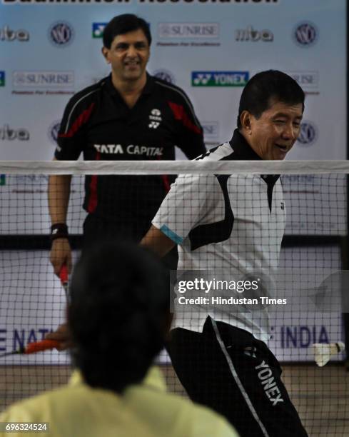 Badminton legends Rudy Hartono and Prakash Padukone play against aspiring players during an initiative from Maharashtra Badminton Association, Yonex...