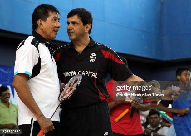 Badminton legends Rudy Hartono and Prakash Padukone play against aspiring players during an initiative from Maharashtra Badminton Association, Yonex...