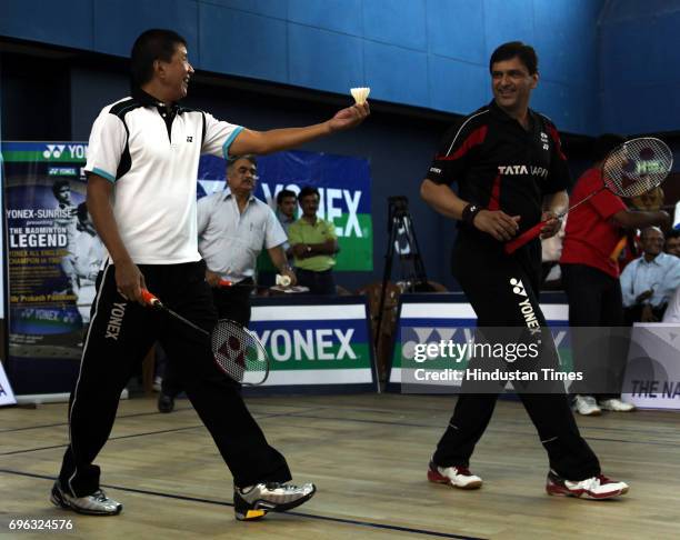 Badminton legends Rudy Hartono and Prakash Padukone play against aspiring players during an initiative from Maharashtra Badminton Association, Yonex...