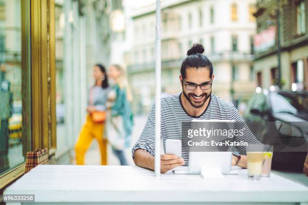 coffee break - hipster coffee shop candid stock pictures, royalty-free photos & images