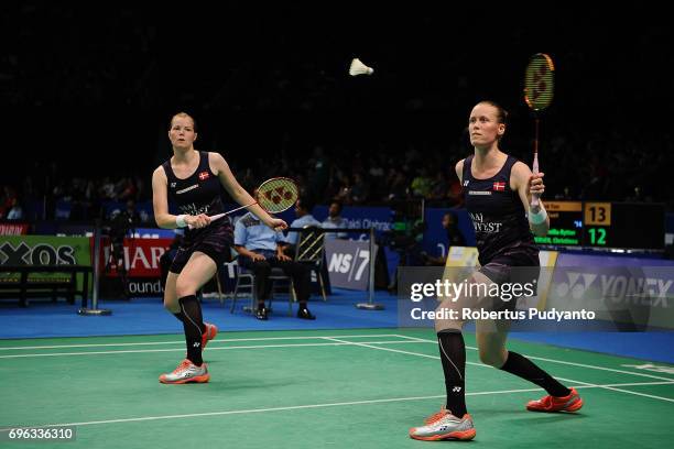 Kamilla Rytter Juhl and Christinna Pedersen of Denmark compete against Poon Lok Yan and Tse Ying Suet of Hong Kong during Womens Double Round 2 match...