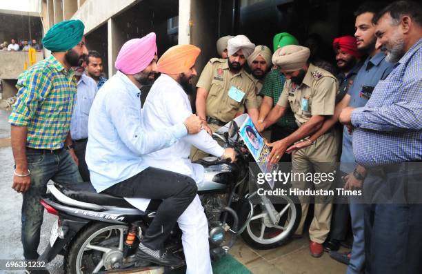 Congress MLA Barminder Pahra and Kulbir Sing Zira trying to enter with bike in Punjab Vidhan Sabha Session on June 15, 2017 in Chandigarh, India.