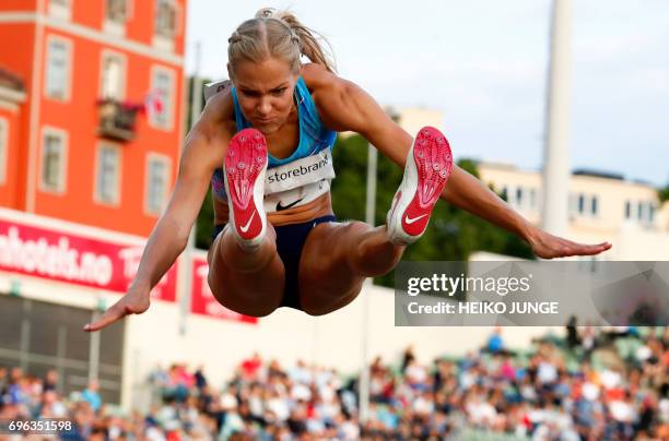 Second placed Darya Klishina competes in the women's long jump at the Golden League Bislett Games at Bislett stadium in Olso on June 15,2017. / AFP...