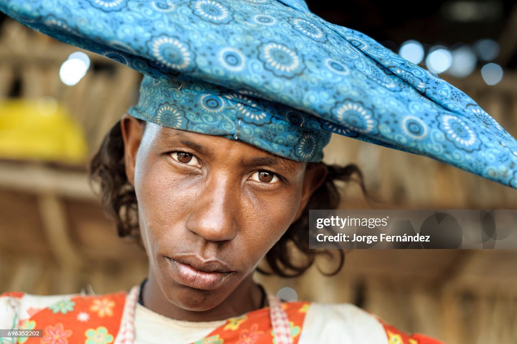 Portrait of a herero woman wearing traditional hat...