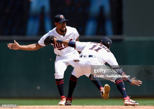 Byron Buxton and Jorge Polanco of the Minnesota Twins celebrate wining the game against the Seattle Mariners on June 15, 2017 at Target Field in...