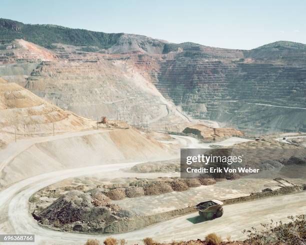 dump truck driving on road of mine - mineral stock pictures, royalty-free photos & images