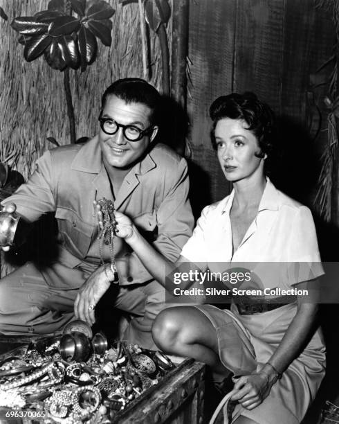 Actors George Reeves as Superman/Clark Kent and Noel Neill as Lois Lane finding a treasure chest in the American television series 'Adventures of...