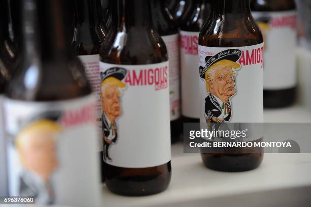 View of Amigous Craft Beer which bottle shows an image of US President Donald Trump wearing a Mariachi costume, in Mexico City, on June 15, 2017. /...