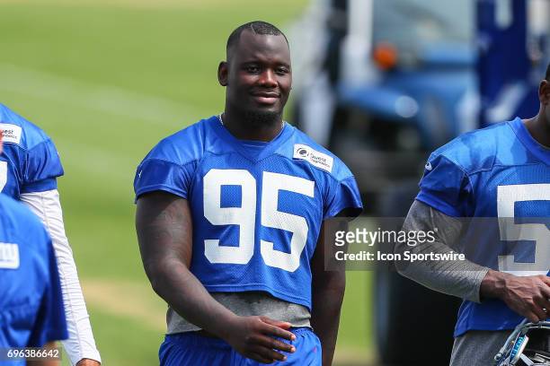 New York Giants defensive end Stansly Maponga walks in at the end of practice during New York Giants Mini Camp on June 14, 2017 at the Quest...