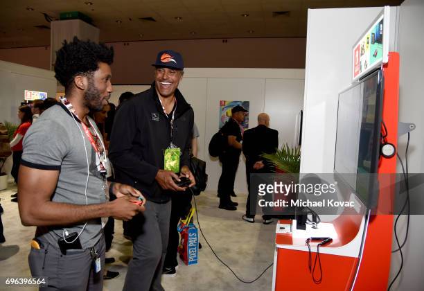 Actor Nyambi Nyambi and basketball player Rick Fox visit the Nintendo booth at the 2017 E3 Gaming Convention at Los Angeles Convention Center on June...