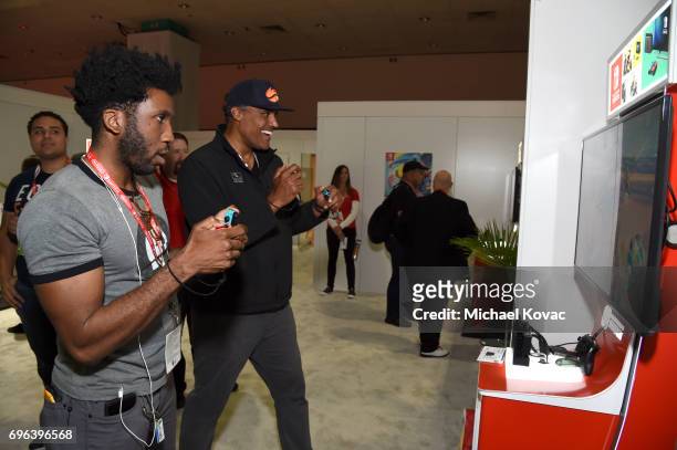 Actor Nyambi Nyambi and basketball player Rick Fox visit the Nintendo booth at the 2017 E3 Gaming Convention at Los Angeles Convention Center on June...