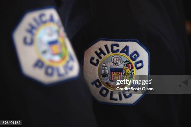 Chicago police officers attend a graduation and promotion ceremony in the Grand Ballroom on Navy Pier on June 15, 2017 in Chicago, Illinois. Several...