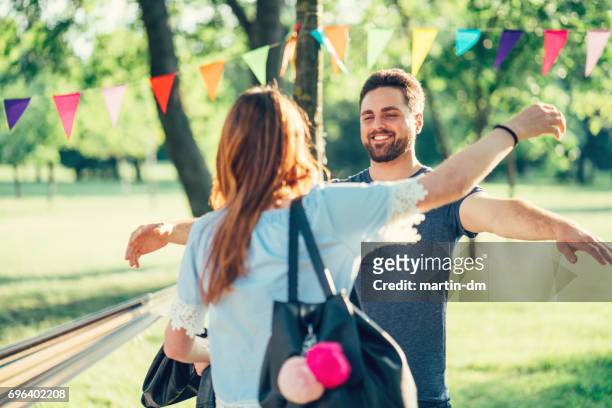 young couple meeting at garden party - introducing girlfriend stock pictures, royalty-free photos & images