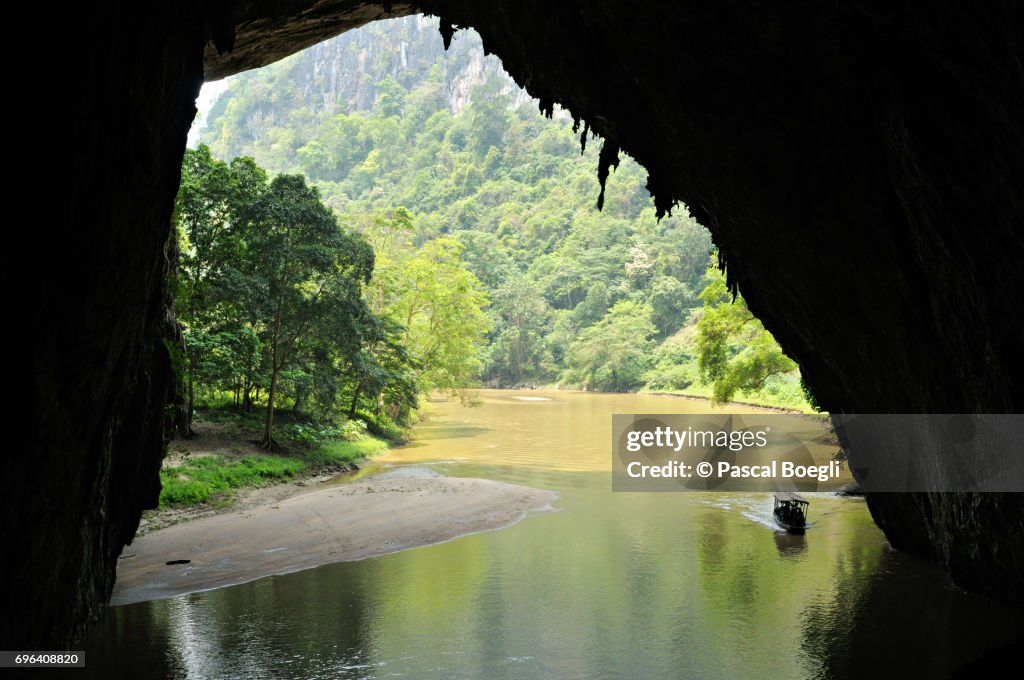 Boat entering Puong Cave, Ba Be National Park, north Vietnam