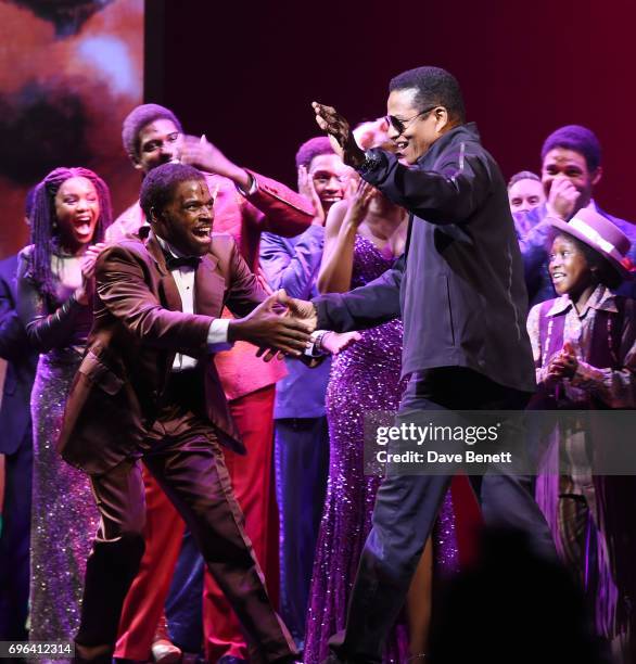 Cedric Neal greets Jackie Jackson of 'The Jackson 5' on stage with cast members of the West End Production Of "Motown The Musical" at the Shaftesbury...