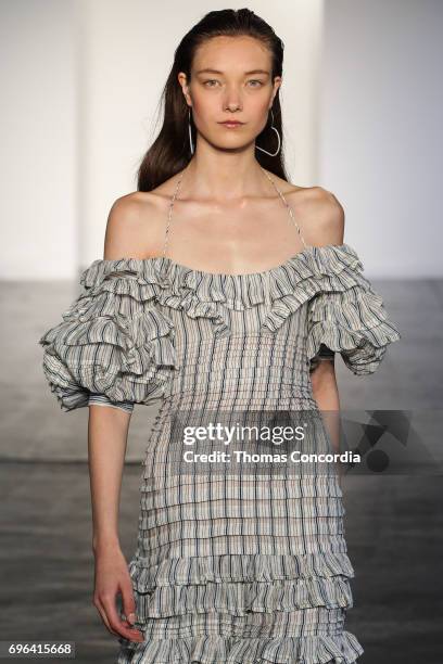 Yumi Lambert walks the runway wearing Zimmermann Resort 2018 at Industria Studios on June 15, 2017 in New York City.