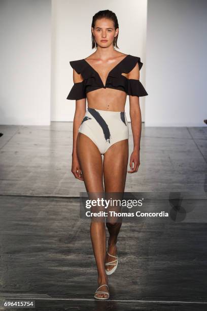 Model walks the runway wearing Zimmermann Resort 2018 at Industria Studios on June 15, 2017 in New York City.