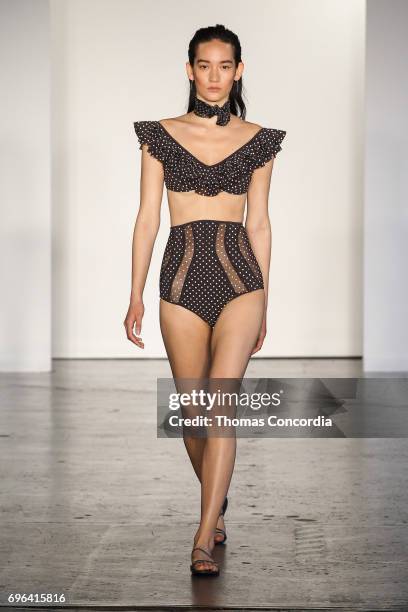 Mona Matsuoka walks the runway wearing Zimmermann Resort 2018 at Industria Studios on June 15, 2017 in New York City.