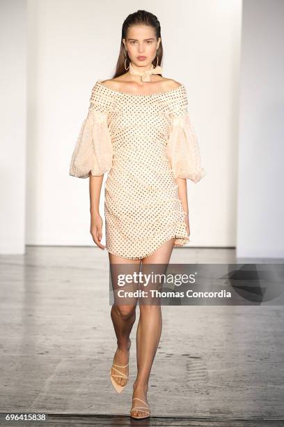 Model walks the runway wearing Zimmermann Resort 2018 at Industria Studios on June 15, 2017 in New York City.