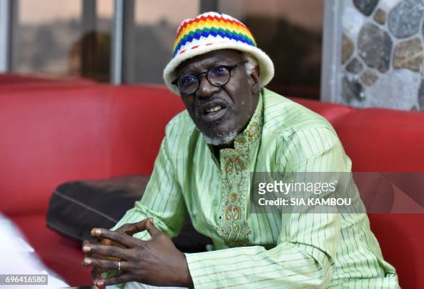 Ivory Coast reggae singer Alpha Blondy speaks during an interview with AFP in Abidjan on June 14, 2017. Blondy on June 14 has called for a general...