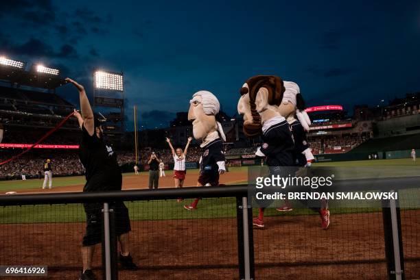 Mascots of former US presidents race during the Congressional Baseball Game between Democrats and Republicans at Nationals Stadium June 15, 2017 in...