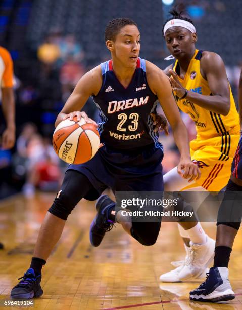 Layshia Clarendon of the Atlanta Dream dribbles the ball around Erica Wheeler of the Indiana Fever at Bankers Life Fieldhouse on June 15, 2017 in...