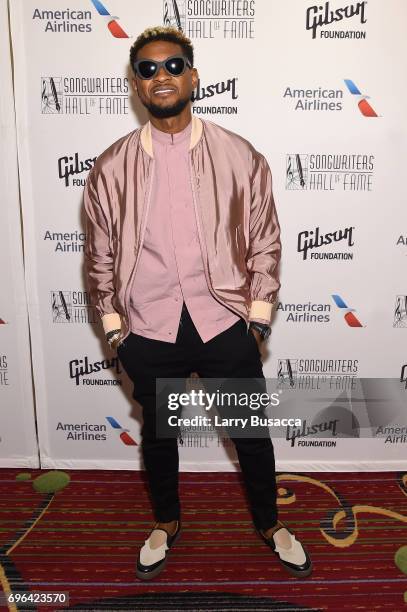 Usher Raymond poses backstage at the Songwriters Hall Of Fame 48th Annual Induction and Awards at New York Marriott Marquis Hotel on June 15, 2017 in...