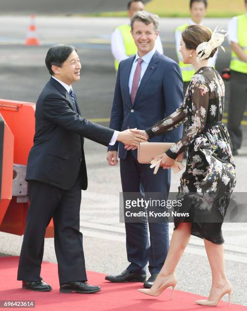 Japan's Crown Prince Naruhito is welcomed by Denmark's Crown Prince Frederik and Crown Princess Mary after arriving in Copenhagen on June 15 for a...