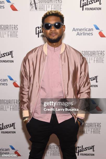 Usher Raymond poses backstage at the Songwriters Hall Of Fame 48th Annual Induction and Awards at New York Marriott Marquis Hotel on June 15, 2017 in...