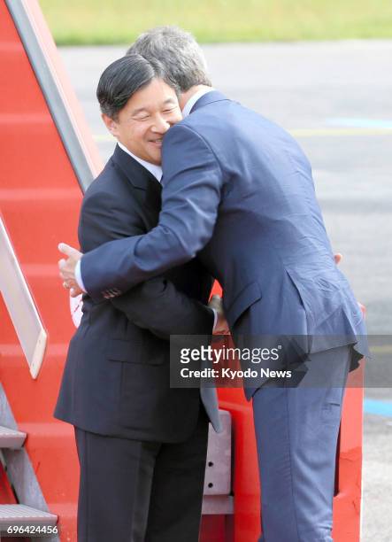 Japan's Crown Prince Naruhito greets Denmark's Crown Prince Frederik after arriving in Copenhagen on June 15 for a weeklong visit to celebrate 150...