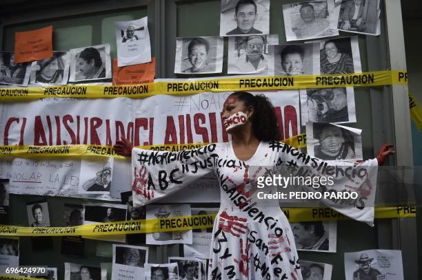 Journalists take part in a protest to mark one month since the murder of their colleague Javier Valdez, a noted expert on the country's drug cartels...