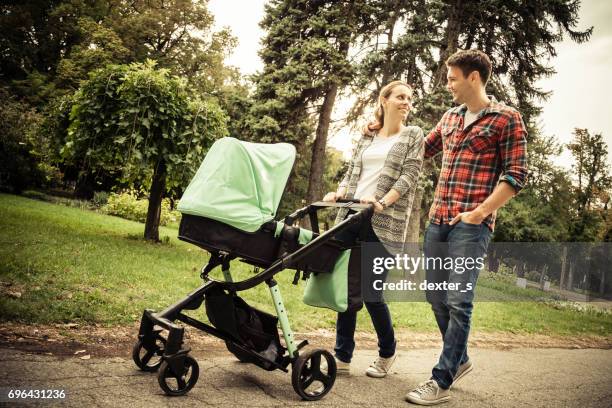 park walking with baby - baby pram in the park stock pictures, royalty-free photos & images