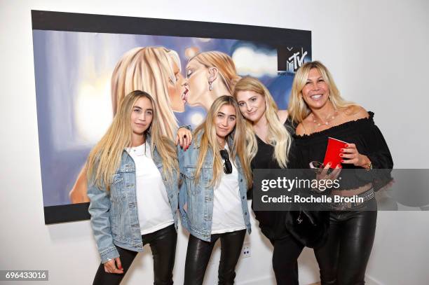 Artists Allie Kaplan and Lexi Kaplan, singer Meghan Trainor, and Amy Kaplan attend the "Make Me Famous" exhibit hosted by The Kaplan Twins at De Re...