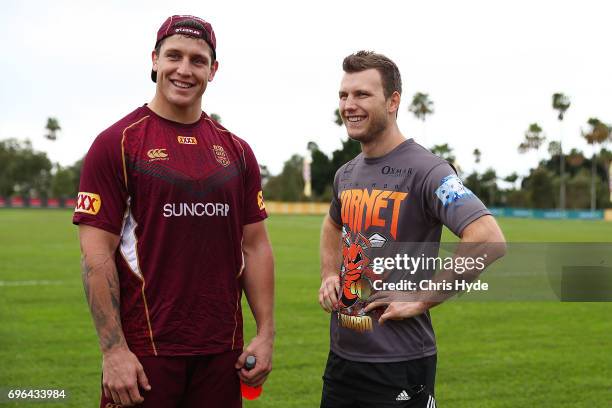 Boxer Jeff Horn talks with Jarrod Wallace during a visit to the Queensland Maroons State of Origin team during a training session at Intercontinental...