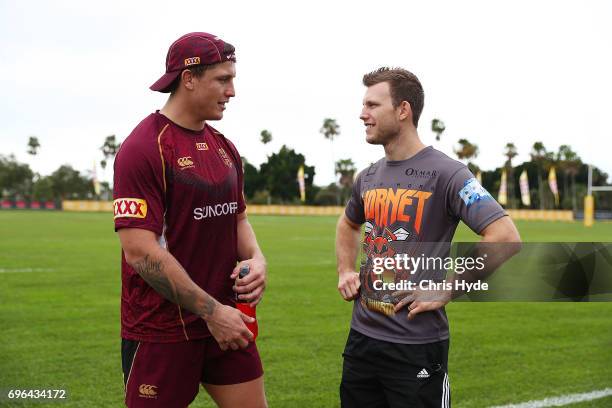 Boxer Jeff Horn talks with Jarrod Wallace during a visit to the Queensland Maroons State of Origin team during a training session at Intercontinental...