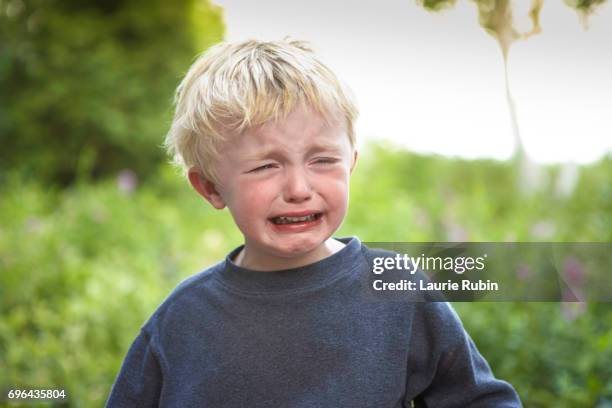 tearful child - child crying stock-fotos und bilder