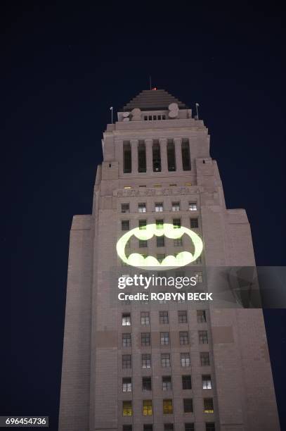 The Batman "Bat-signal" is projected onto Los Angeles City Hall in a tribute to the late actor Adam West, June 15 in Los Angeles, California. West,...