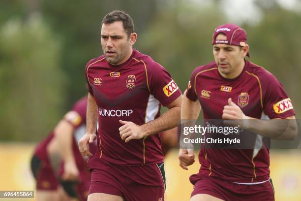 Cameron Smith and Billy Slater run during a Queensland Maroons State of Origin training session at Intercontinental Sanctuary Cove Resort on June 16,...