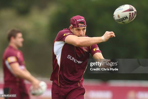 Billy Slater passes during a Queensland Maroons State of Origin training session at Intercontinental Sanctuary Cove Resort on June 16, 2017 in...