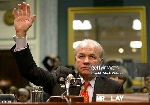 Former Enron Chairman Kenneth Lay raises his right hand as he is sworn in before the Senate Committee on Commerce Science and Transportation February...