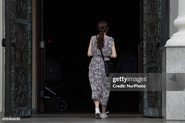 People are seen leaving the Saint Vincent de Paul basilica after mass on Corpus Christi day on 15 June, 2017.