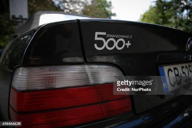 Car with a sticker mocking the 500 plus family subsidy program is seen in the center of the city on 15 June, 2017. The conservative government lead...
