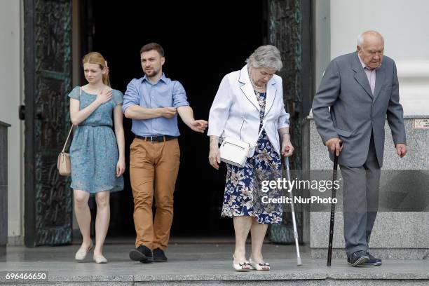 People are seen leaving the Saint Vincent de Paul basilica after mass on Corpus Christi day on 15 June, 2017.