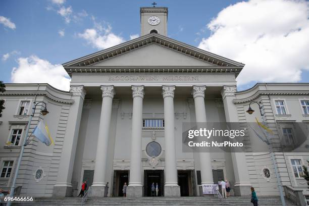 People are seen leaving the Saint Vincent de Paul basilica after mass on Corpus Christi day on 15 June, 2017.