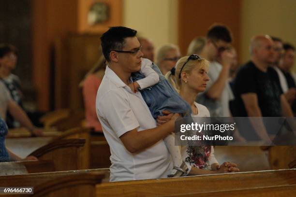 People are seen attending a mass on Corpus Christi day at the Vincent de Paul basilica on 15 June, 2017. Corpus Christi is a national holiday in...