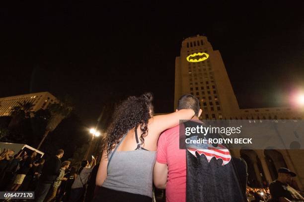 The Batman "Bat-signal" is projected onto Los Angeles City Hall in a tribute to the late actor Adam West, June 15 in Los Angeles, California. West,...