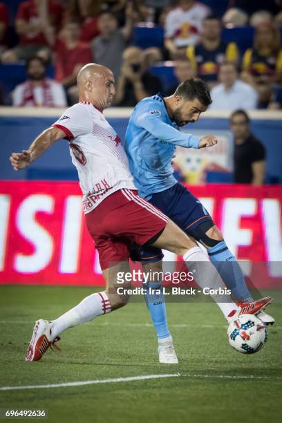 Captain David Villa of New York City FC takes the shot on goal past Aurélien Collin of the New York Red Bulls during the 2017 Hunt Lamar U.S. Open...