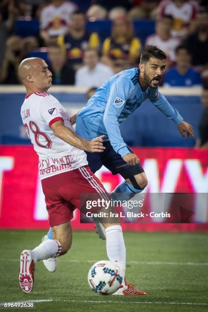 Captain David Villa of New York City FC tries to get a shot past Aurélien Collin during the 2017 Hunt Lamar U.S. Open soccer match between New York...
