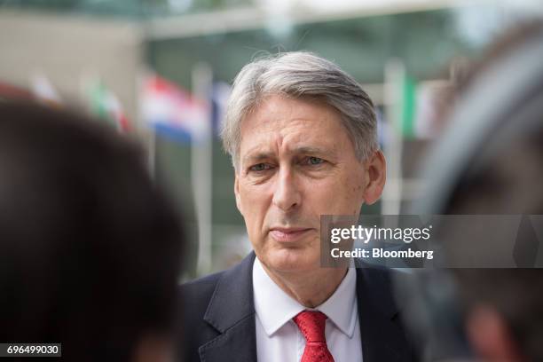 Philip Hammond, U.K. Chancellor of the exchequer, speaks to journalists as he arrives for an Ecofin meeting of European Union finance ministers in...